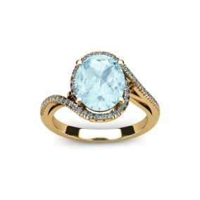 1 1/3 Carat Oval Shape Aquamarine and Halo Diamond Ring In 14 Karat Yellow Gold