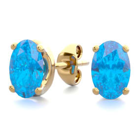 1 Carat Oval Shape Blue Topaz Stud Earrings In 14K Yellow Gold Over Sterling Silver