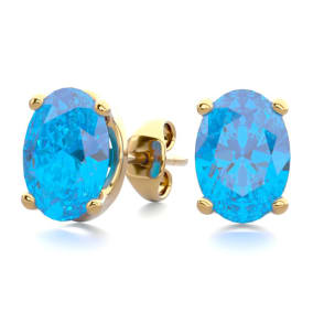 2 Carat Oval Shape Blue Topaz Stud Earrings In 14K Yellow Gold Over Sterling Silver