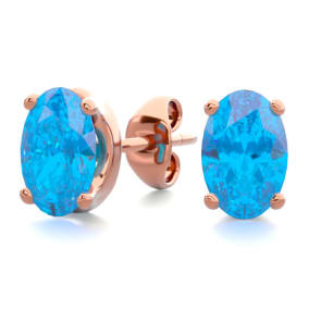 1 Carat Oval Shape Blue Topaz Stud Earrings In 14K Rose Gold Over Sterling Silver