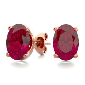 2 Carat Oval Shape Ruby Stud Earrings In 14K Rose Gold Over Sterling Silver