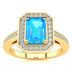 1 1/2 Carat Blue Topaz and Halo Diamond Ring In 14 Karat Yellow Gold