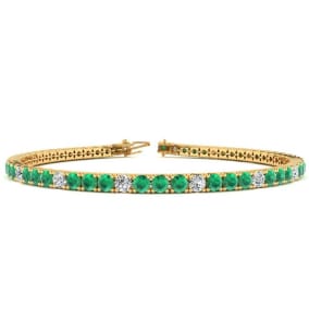 5 1/3 Carat Emerald And Diamond Graduated Tennis Bracelet In 14 Karat Yellow Gold, 8 1/2 Inches