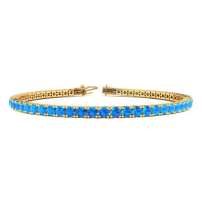 5 1/2 Carat Blue Topaz Tennis Bracelet In 14 Karat Yellow Gold Available In 6-9 Inch Lengths