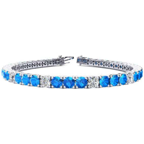 11 2/3 Carat Blue Topaz and Diamond Graduated Tennis Bracelet In 14 Karat White Gold Available In 6-9 Inch Lengths