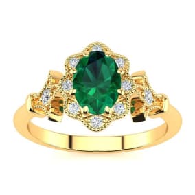 1 Carat Oval Shape Emerald and Halo Diamond Vintage Ring In 14 Karat Yellow Gold
