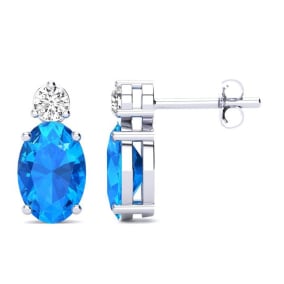 1 Carat Oval Blue Topaz and Diamond Stud Earrings In 14 Karat White Gold