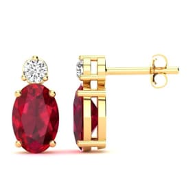 1 Carat Oval Ruby and Diamond Stud Earrings In 14 Karat Yellow Gold