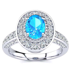 1 2/3 Carat Oval Shape Blue Topaz and Halo Diamond Ring In 14 Karat White Gold