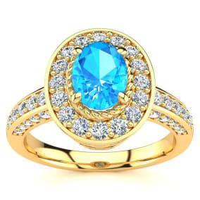 1 2/3 Carat Oval Shape Blue Topaz and Halo Diamond Ring In 14 Karat Yellow Gold