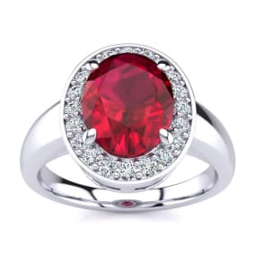3 Carat Oval Shape Ruby and Halo Diamond Ring In 14 Karat White Gold
