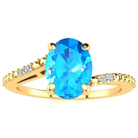 1 1/2ct Oval Shape Blue Topaz and Diamond Ring in 10k Yellow Gold