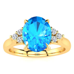 2 1/4 Carat Oval Shape Blue Topaz and Diamond Ring In 14K Yellow Gold