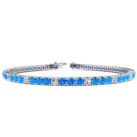 4 1/3 Carat Blue Topaz And Diamond Alternating Tennis Bracelet In 14 Karat White Gold Available In 6-9 Inch Lengths