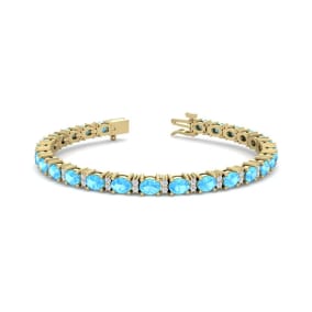 6 Carat Oval Shape Blue Topaz and Diamond Bracelet In 14 Karat Yellow Gold, 7 Inches