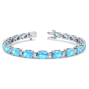 11 Carat Oval Shape Blue Topaz and Diamond Bracelet In 14 Karat White Gold, 7 Inches