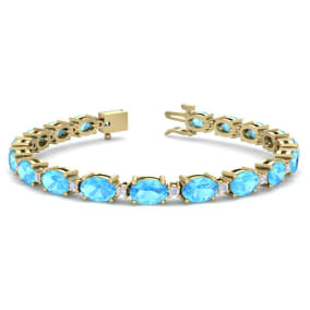 11 Carat Oval Shape Blue Topaz and Diamond Bracelet In 14 Karat Yellow Gold, 7 Inches