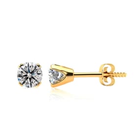 Nearly 1/2 Carat Colorless Diamond Stud Earrings In 14 Karat Yellow Gold