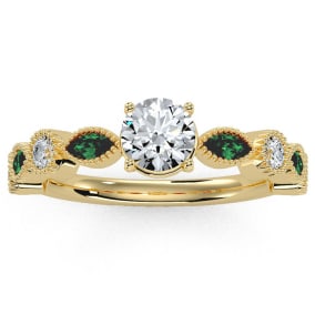 1 1/4 Carat Round and Marquise Vintage Diamond and Emerald Engagement Ring In 14 Karat Yellow Gold