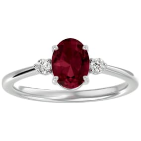 1 1/2 Carat Oval Shape Garnet and Two Diamond Ring In 14 Karat White Gold