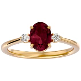 1 1/2 Carat Oval Shape Garnet and Two Diamond Ring In 14 Karat Yellow Gold