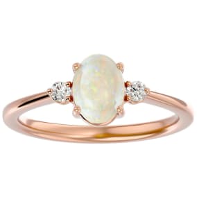 1 Carat Oval Shape Opal Ring with Two Diamonds In 14 Karat Rose Gold