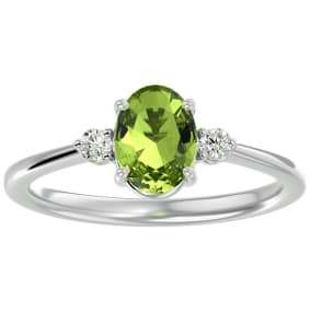 1 1/2 Carat Oval Shape Peridot and Two Diamond Ring In 14 Karat White Gold