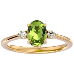 1 1/2 Carat Oval Shape Peridot and Two Diamond Ring In 14 Karat Yellow Gold