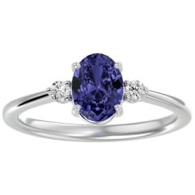 1 1/2 Carat Oval Shape Tanzanite and Two Diamond Ring In 14 Karat White Gold