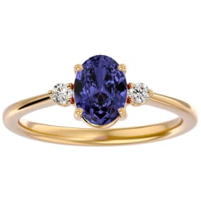 1 1/2 Carat Oval Shape Tanzanite and Two Diamond Ring In 14 Karat Yellow Gold
