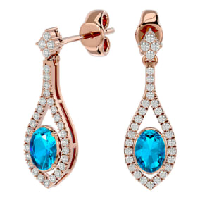 2 1/2 Carat Oval Shape Blue Topaz and Diamond Dangle Earrings In 14 Karat Rose Gold