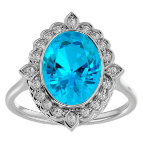 1 3/4 Carat Oval Shape Blue Topaz and Halo Diamond Ring In 14 Karat White Gold