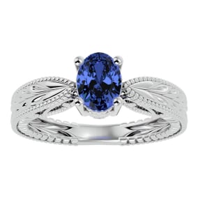 1 1/3 Carat Oval Shape Tanzanite Ring With Tapered Etched Band In 14 Karat White Gold
