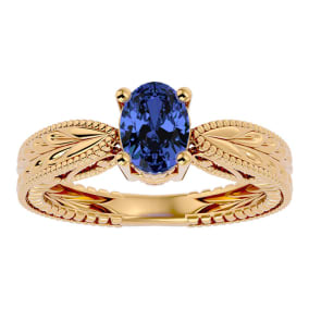 1 1/3 Carat Oval Shape Tanzanite Ring With Tapered Etched Band In 14 Karat Yellow Gold