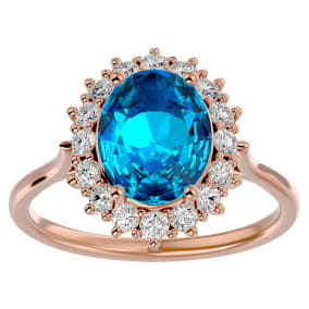 3 3/4 Carat Oval Shape Blue Topaz and Halo Diamond Ring In 14 Karat Rose Gold