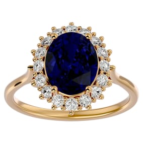 3.60 Carat Oval Shape Sapphire and Halo Diamond Ring In 14 Karat Yellow Gold