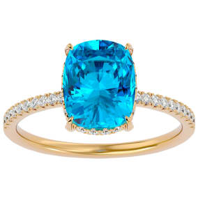 3 3/4 Carat Antique Cushion Shape Blue Topaz and Hidden Halo Diamond Ring In 14 Karat Yellow Gold