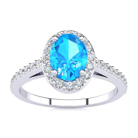 Blue Topaz Ring: 1 Carat Oval Shape Blue Topaz and Halo Diamond Ring In Sterling Silver