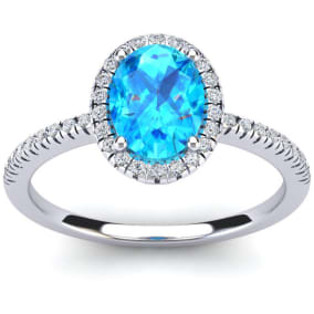 Blue Topaz Ring: 1 1/2 Carat Oval Shape Blue Topaz and Halo Diamond Ring In Sterling Silver
