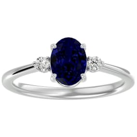 Sapphire Ring: 1 1/3 Carat Oval Shape Created Sapphire and Two Diamond Ring In Sterling Silver