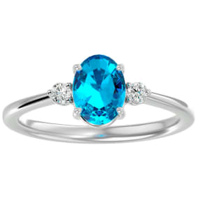 Blue Topaz Ring: 1 1/3 Carat Oval Shape Blue Topaz and Two Diamond Ring In Sterling Silver