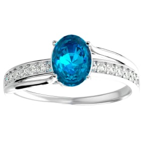 Blue Topaz Ring: 1 1/2 Carat Oval Shape Blue Topaz and Diamond Ring In Sterling Silver