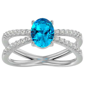 Blue Topaz Ring: 1 1/2 Carat Oval Shape Blue Topaz and Halo Diamond Ring In Sterling Silver