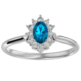Blue Topaz Ring: 2/3 Carat Oval Shape Blue Topaz and Halo Diamond Ring In Sterling Silver