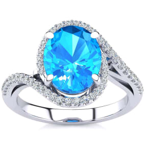 Blue Topaz Ring: 2 3/4 Carat Oval Shape Blue Topaz and Halo Diamond Ring In Sterling Silver