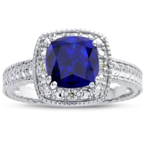 Sapphire Ring: 1 1/4 Carat Cushion Cut Created Sapphire and Halo Diamond Ring In Sterling Silver