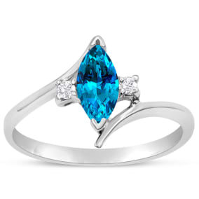 Blue Topaz Ring: 1/2 Carat Marquise Shape Blue Topaz and Diamond Ring In Sterling Silver