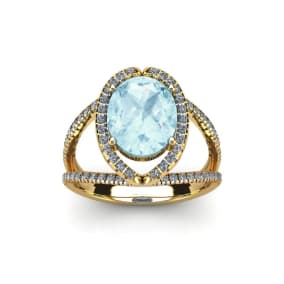 Retrograde Birthstones™ 1 1/2 Carat Oval Shape Aquamarine and Halo Diamond Ring In 14 Karat Yellow Gold
