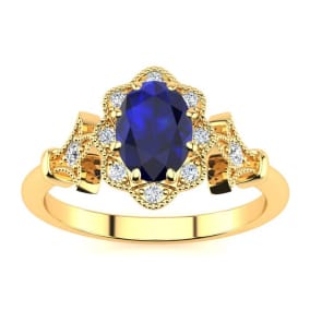1 Carat Oval Shape Sapphire and Halo Diamond Vintage Ring In 14 Karat Yellow Gold