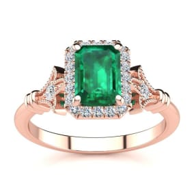 1 Carat Emerald and Halo Diamond Vintage Ring In 14 Karat Rose Gold